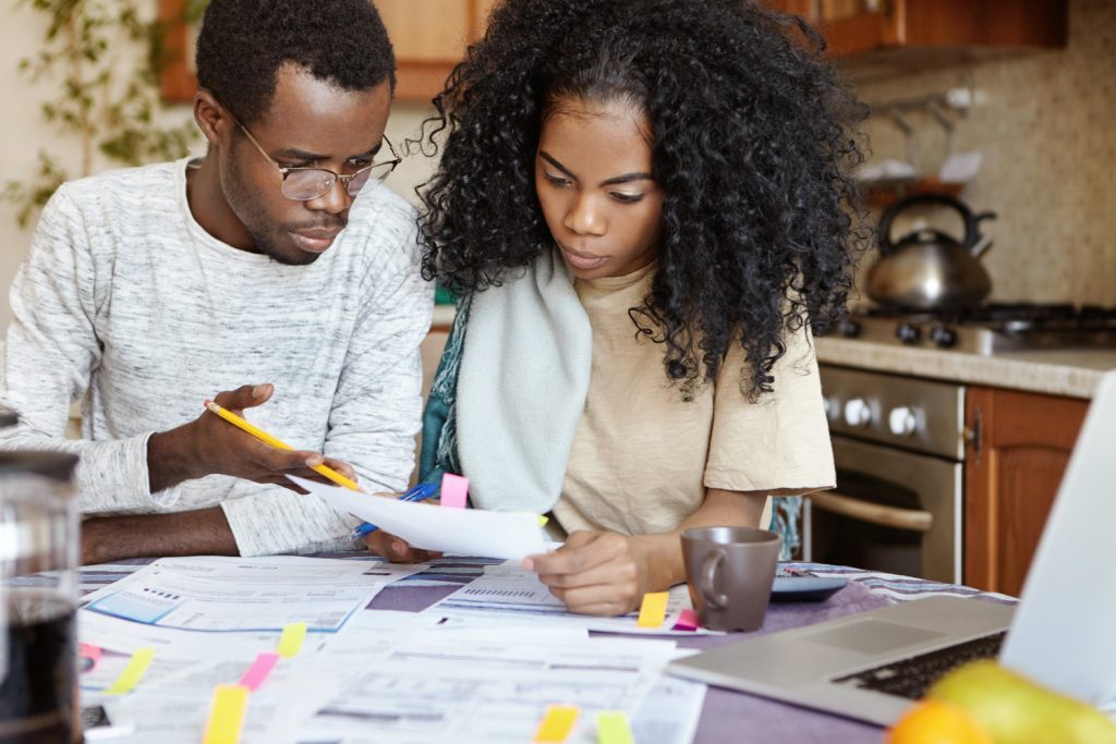 Couple reviewing budget